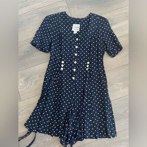 Vintage navy pocka dot romper
100% Rayon